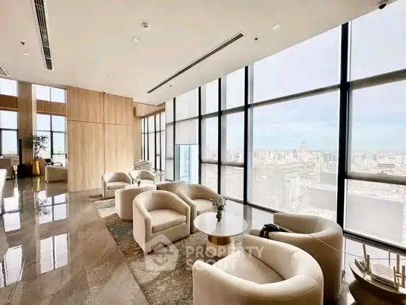Luxurious high-rise living room with panoramic city views and elegant furnishings.