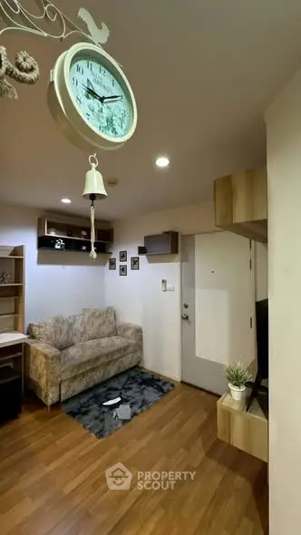 Cozy living room with modern decor and wooden flooring.