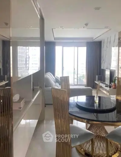 Luxurious modern living room with elegant dining area and large windows.