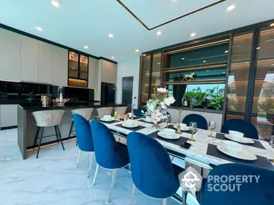 Luxurious modern kitchen with elegant dining area and stylish decor