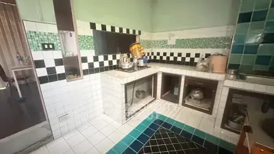 Charming kitchen with unique tile design and open shelving, perfect for culinary enthusiasts.