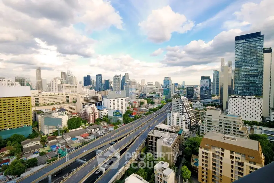 Stunning cityscape view showcasing modern skyscrapers and urban infrastructure under a vibrant sky.