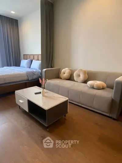 Modern studio apartment with cozy living area and stylish bedroom