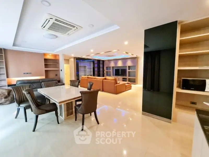 Spacious modern living room with open layout and elegant dining area