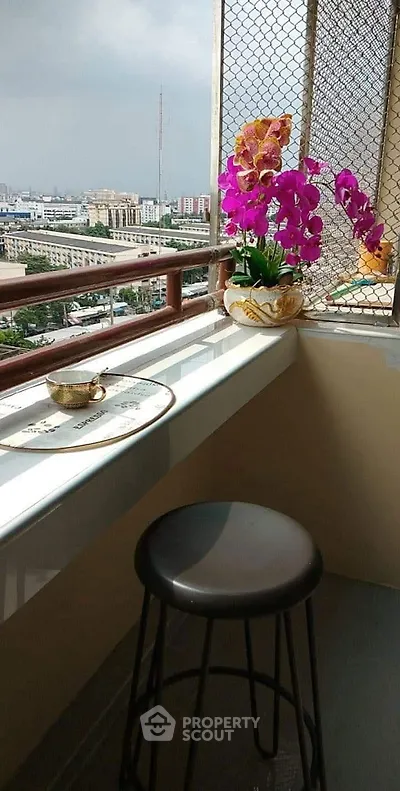 Charming balcony with city view, perfect for morning coffee and relaxation.