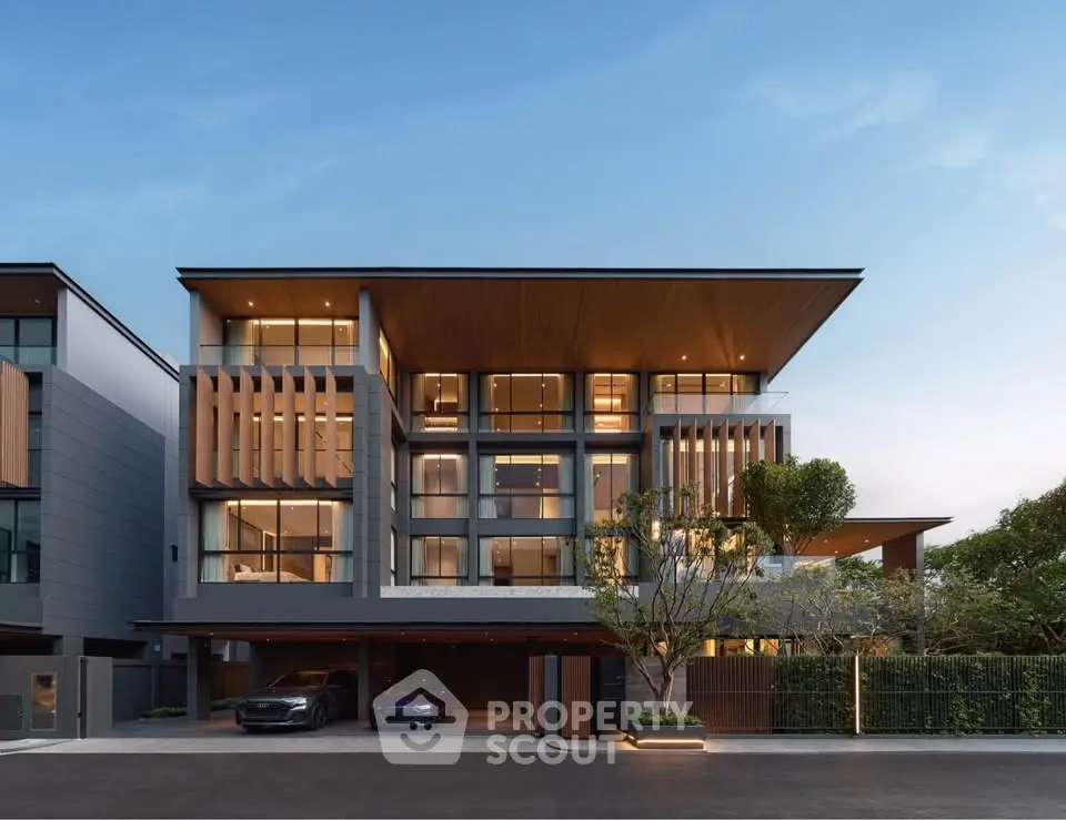 Luxurious modern multi-story home with sleek design and spacious balconies.
