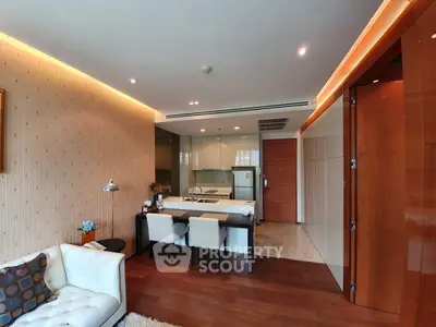 Modern open-layout living room with elegant kitchen and stylish decor