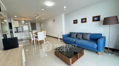 Spacious modern living room with open kitchen and stylish decor