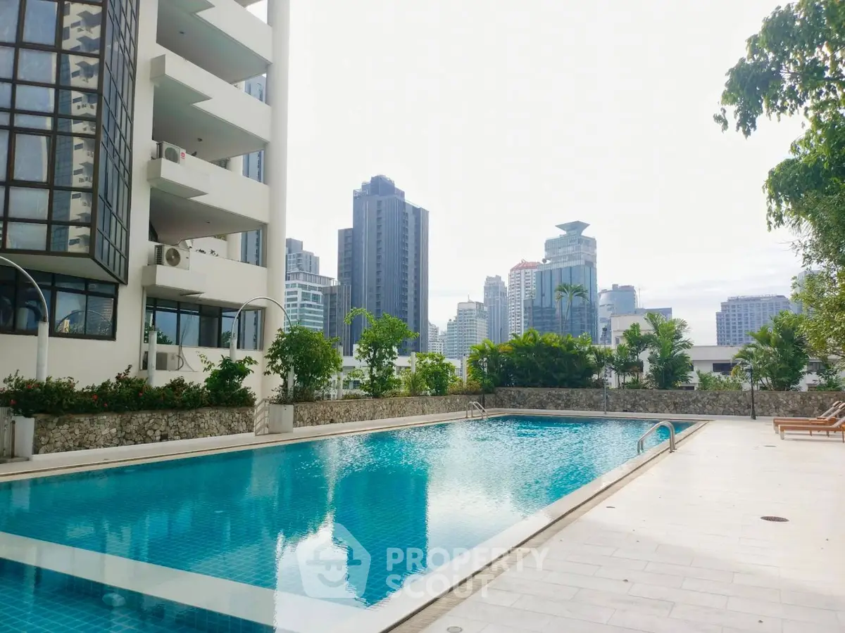 Luxurious city apartment with stunning pool and skyline views.