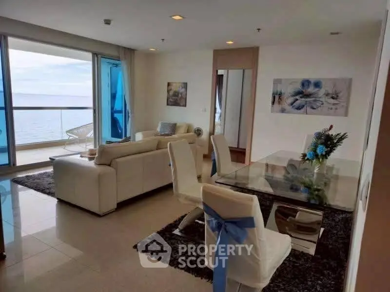 Luxurious living room with ocean view and elegant dining area