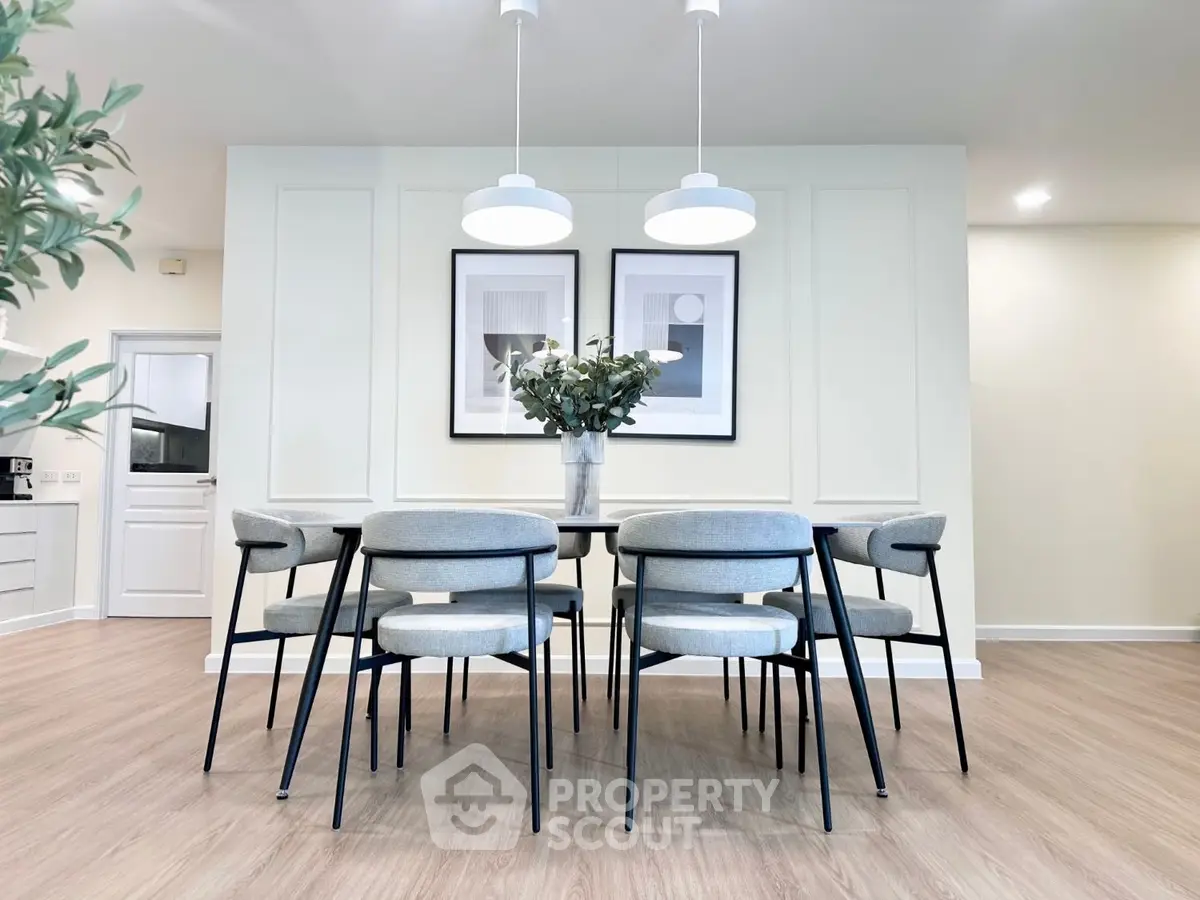 Modern dining area with elegant decor and stylish lighting fixtures