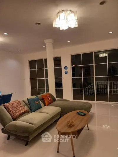 Elegant living room with modern sofa and stylish lighting, perfect for relaxation and entertaining.