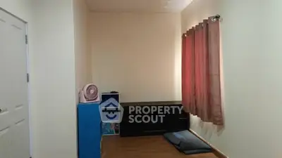 Minimalist study room with desk and shelves, featuring warm lighting and wooden flooring.