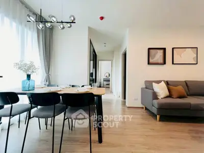 Modern open-plan living and dining area with stylish decor and natural light.