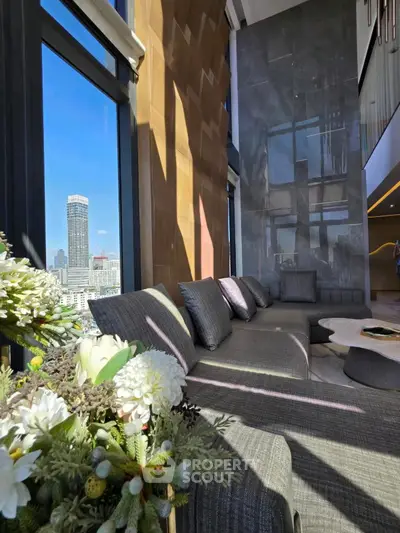 Luxurious high-rise living room with panoramic city views and elegant decor