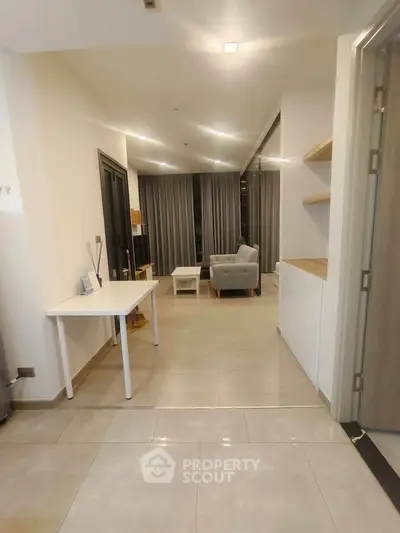 Modern living room with sleek furniture and elegant decor in a contemporary apartment.