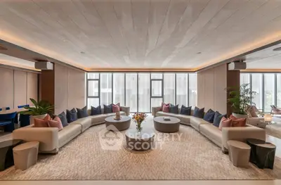 Luxurious modern living room with elegant curved sofas and panoramic windows