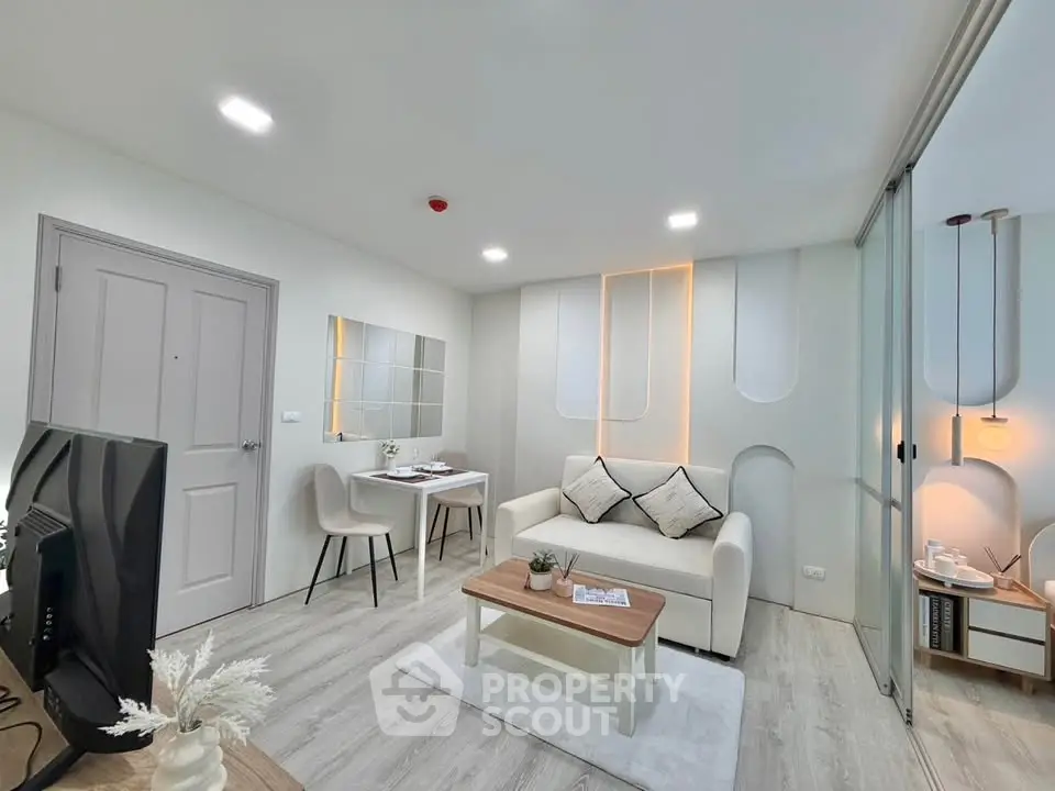 Modern living room with stylish decor and cozy seating area, perfect for relaxation and entertainment.