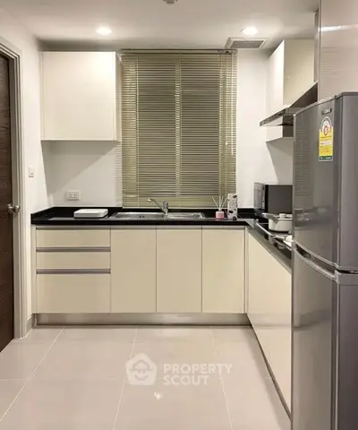 Modern kitchen with sleek cabinets and stainless steel appliances