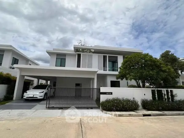 Modern two-story house with sleek design and spacious driveway