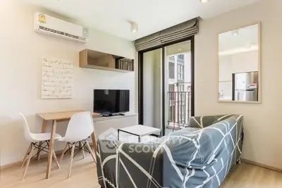 Modern living room with stylish decor and balcony view