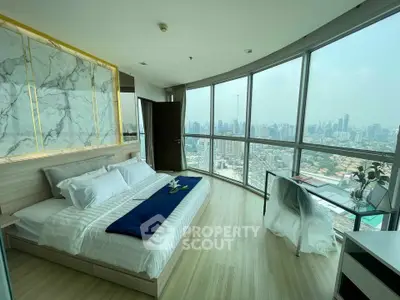 Luxurious bedroom with panoramic city view and elegant decor in high-rise apartment.