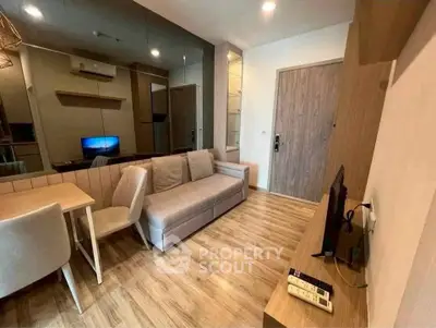 Modern living room with stylish furniture and wooden flooring in a cozy apartment.