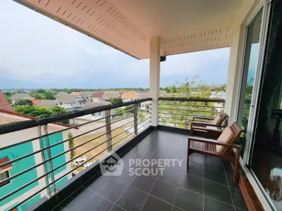 Spacious balcony with scenic view in modern residential area, perfect for relaxation and outdoor enjoyment.