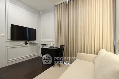 Modern living room with elegant decor and wall-mounted TV