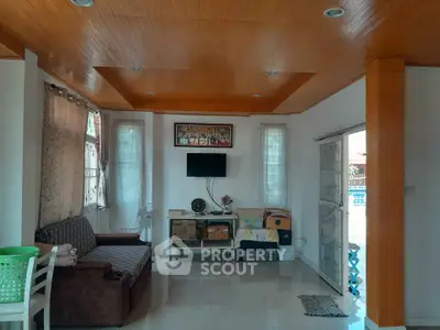 Spacious living room with modern decor and natural lighting