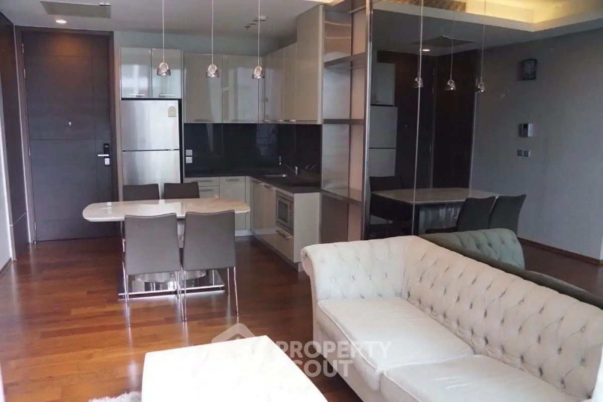 Luxurious open-plan living room with modern kitchen and elegant furnishings
