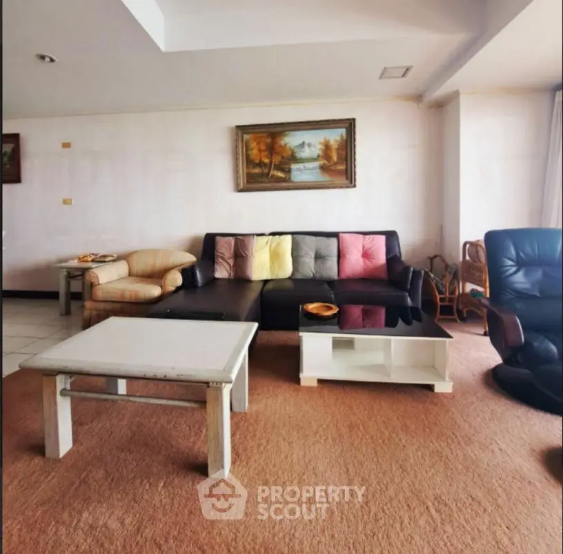 Spacious living room with cozy seating and elegant decor