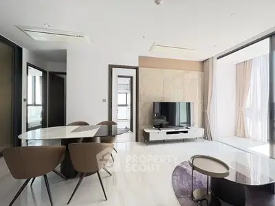 Modern living room with sleek furniture and natural light, perfect for stylish urban living.