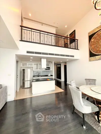 Stunning open-plan living area with modern kitchen and high ceilings