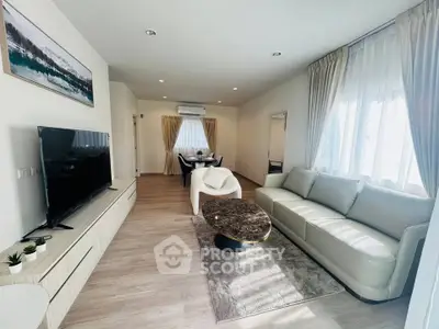 Spacious modern living room with elegant decor and natural light