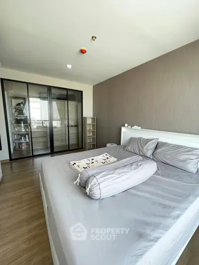 Spacious bedroom with modern design and large wardrobe