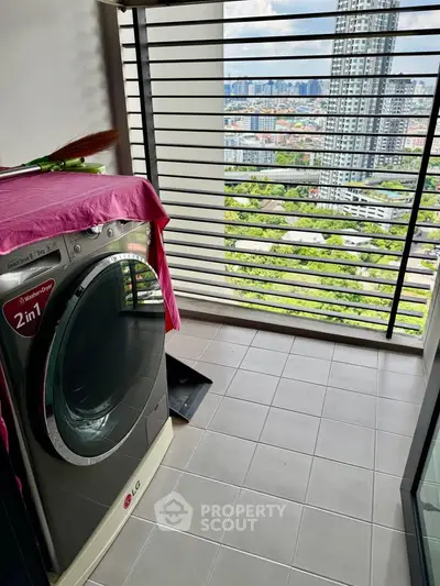 Modern high-rise balcony with washing machine and stunning city view
