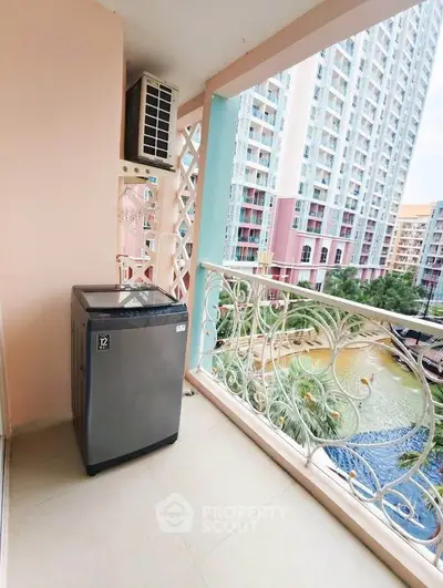 Charming balcony with washing machine and scenic view of modern high-rise buildings.