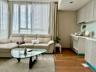 Modern living room with large windows and stylish furniture