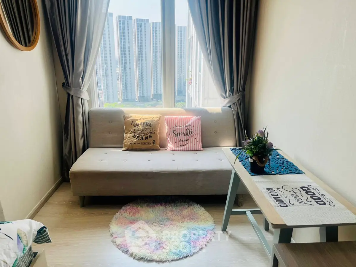 Cozy living room with modern decor and city view, featuring a stylish sofa and decorative cushions.