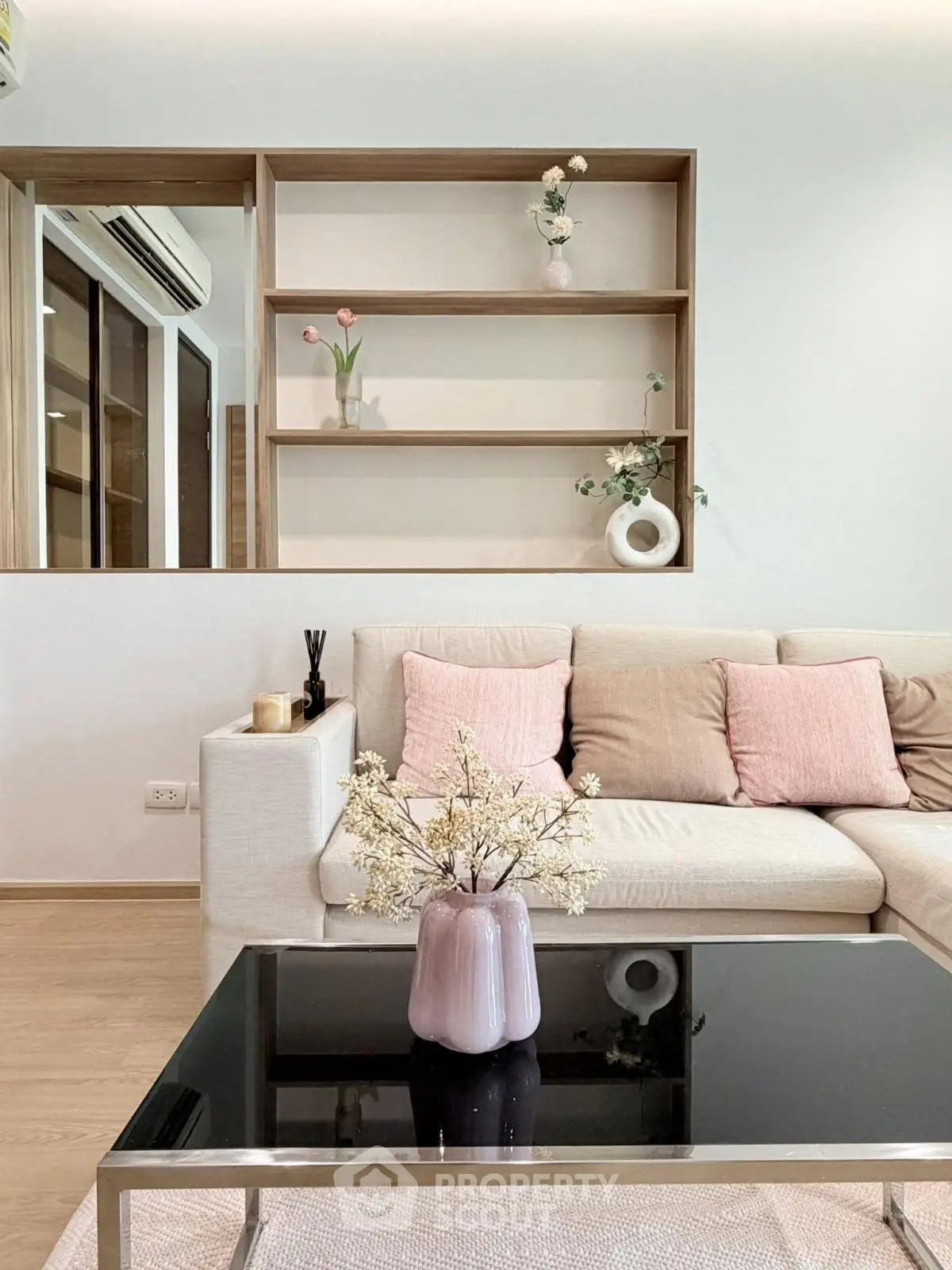 Stylish living room with modern decor and cozy seating area, perfect for relaxation and entertaining.