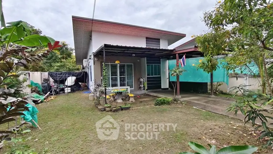 Charming single-story home with lush garden and spacious outdoor area, perfect for family living.