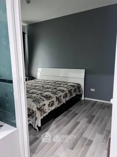 Modern bedroom with stylish flooring and elegant decor