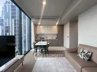 Modern living room with open kitchen and city view in luxury apartment