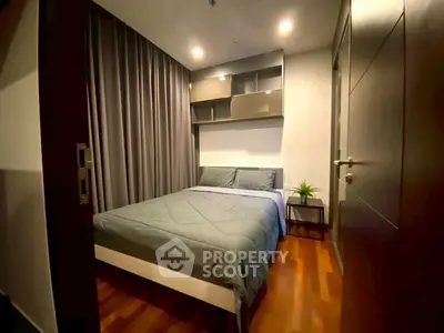 Cozy modern bedroom with wooden flooring and stylish decor