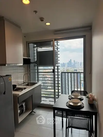 Modern kitchen with city view, featuring sleek appliances and dining area in high-rise apartment.
