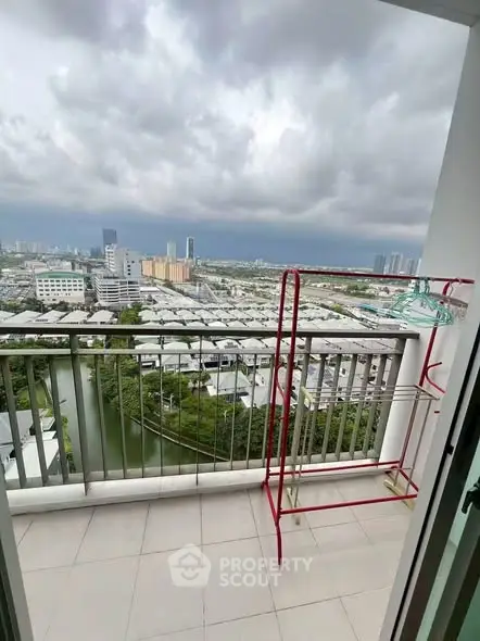 Stunning balcony view overlooking cityscape with ample space for relaxation.