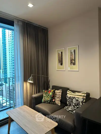 Cozy living room with modern decor and city view balcony in urban apartment.