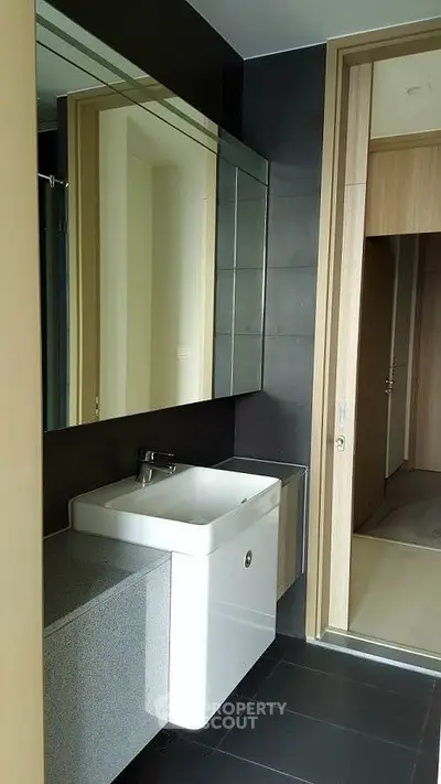 Modern bathroom with sleek design and large mirror