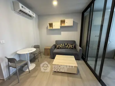 Modern living room with sleek furniture and air conditioning in a cozy apartment.